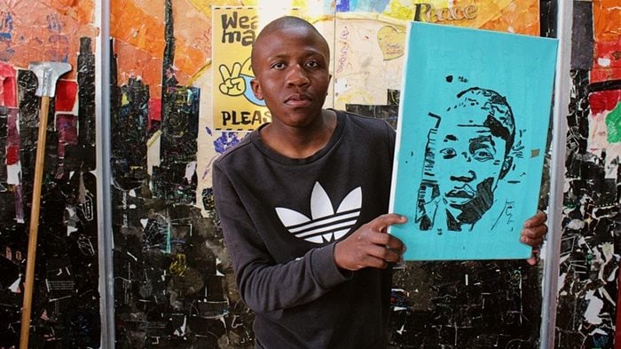 Hlomla Sithole with one of his artworks. He has been coming to the centre for eight years. | Source: Masego Mafata